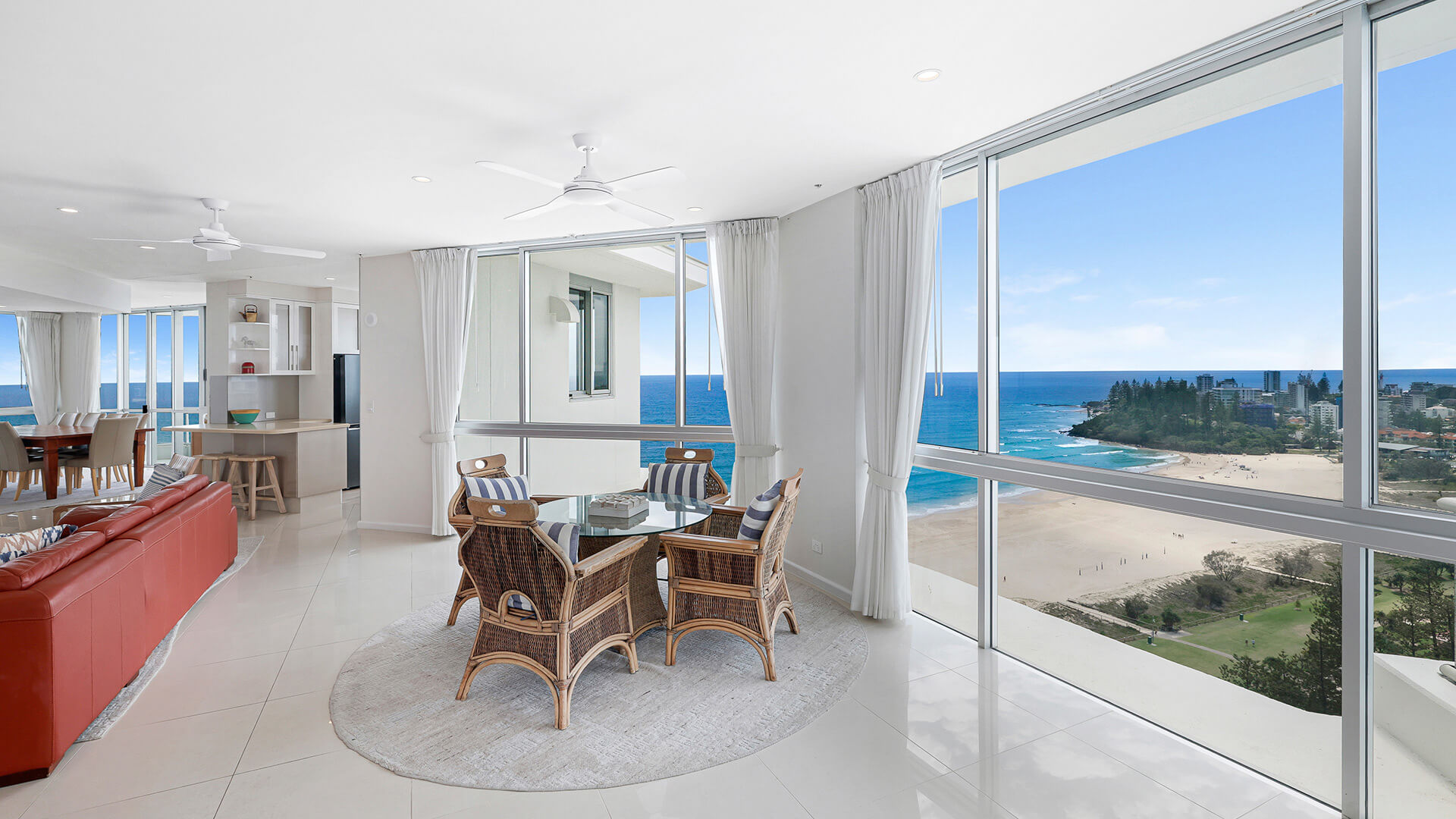 Casual sitting area of the 4 Bedroom Oceanfront Penthouse at ULTIQA Points North with views over the beach and ocean.