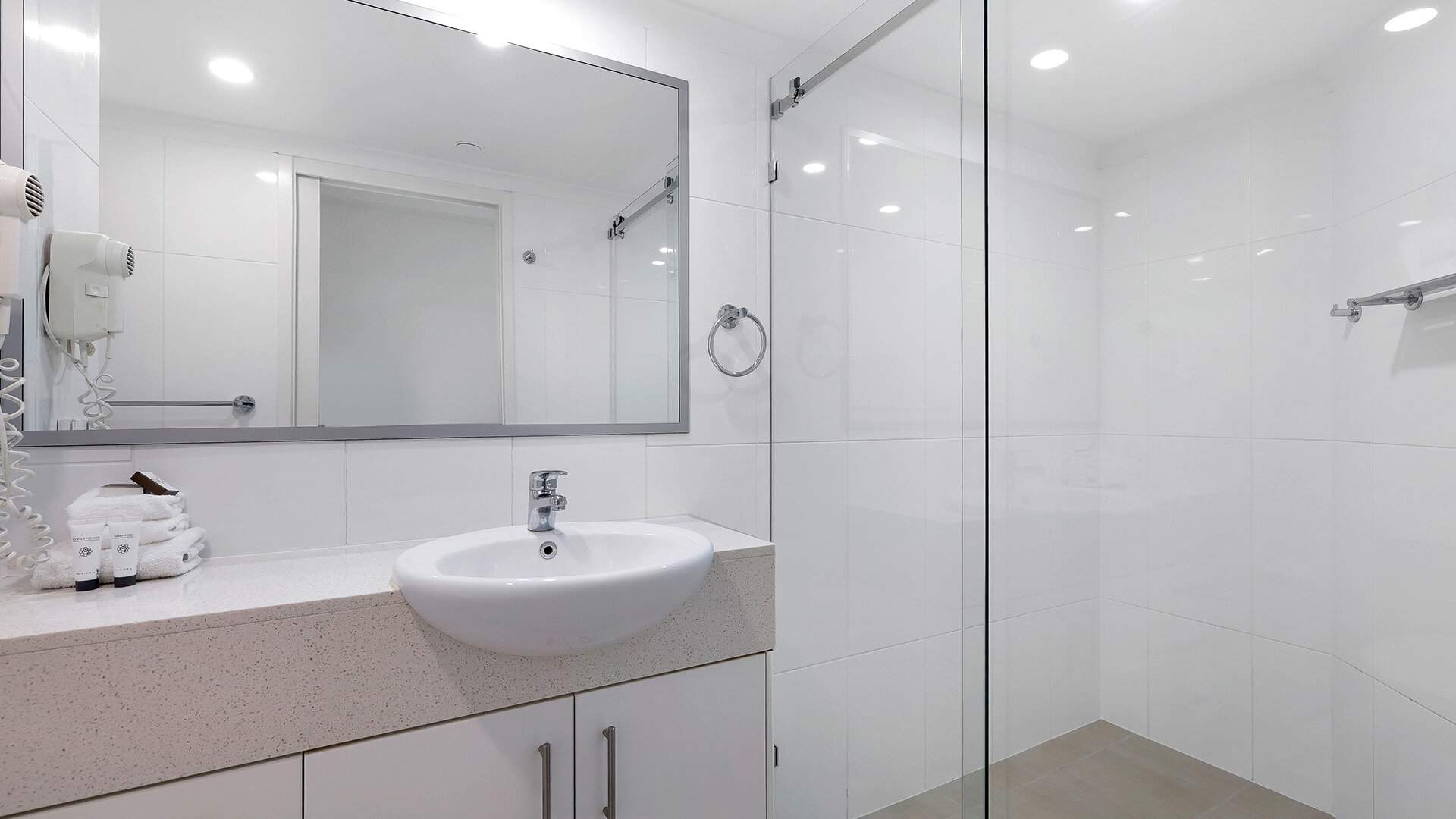 Modern bathroom in the Deluxe 2 Bedroom Centre Front Apartment at ULTIQA Points North with walk-in shower.