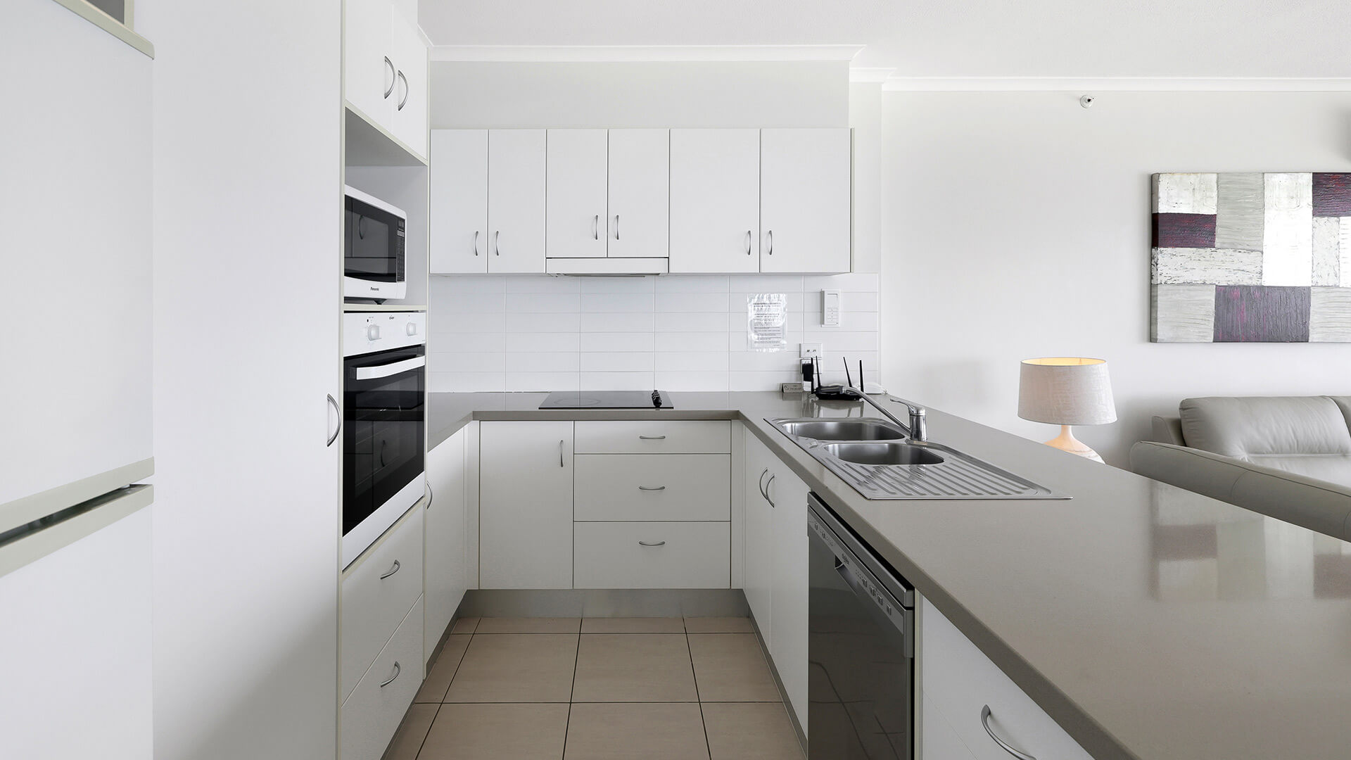 Fully equipped modern kitchen in the Deluxe 2 Bedroom Centre Front Apartment at ULTIQA Points North.