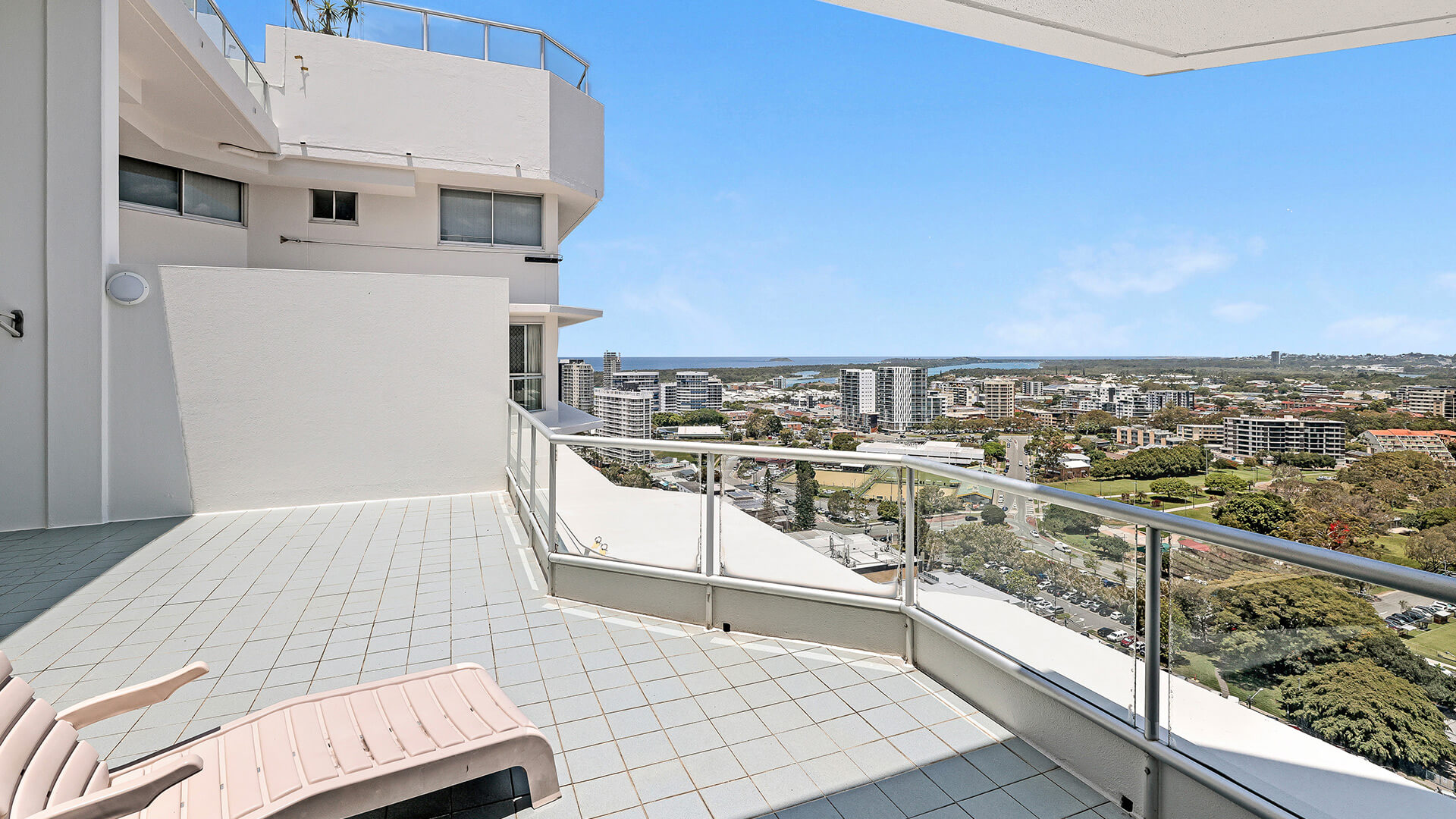 Spacious private balcony with city and hinterland views at ULTIQA Points North.