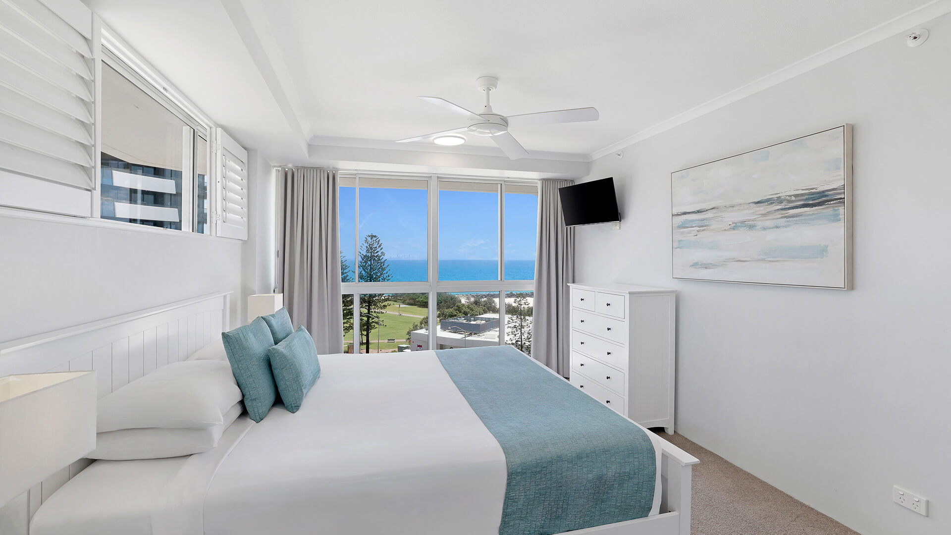 Master bedroom in the Standard 2 Bedroom Centre Front Apartment at ULTIQA Points North, featuring ocean views.