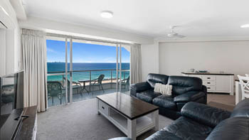 Spacious oceanfront lounge area with furnished patio & Ocean Views in the Superior 1 Bedroom Ocean View Apartment at ULTIQA Points North.